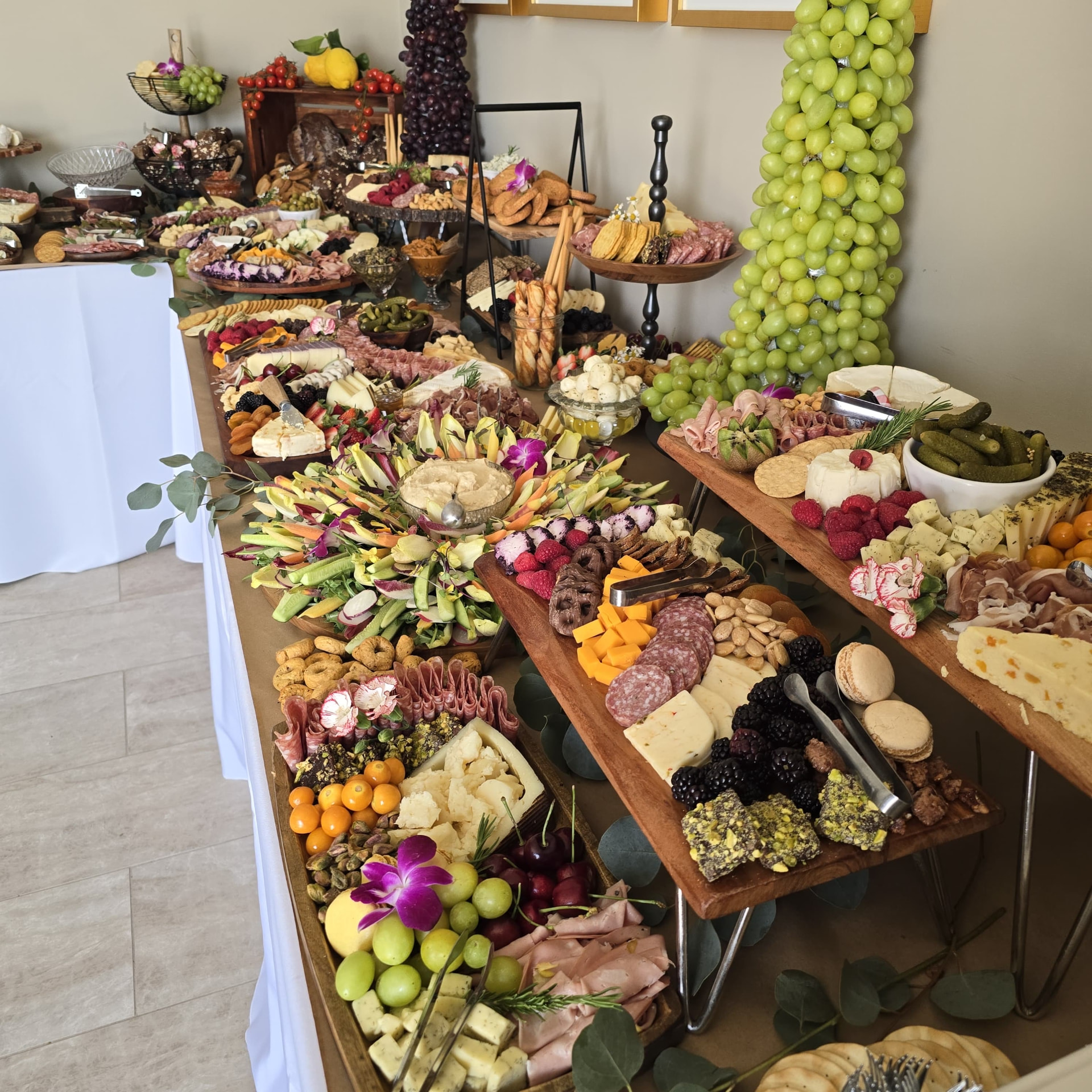 Kosher catering spread with grazing display, salads, appetizers and desserts at a Los Angeles event